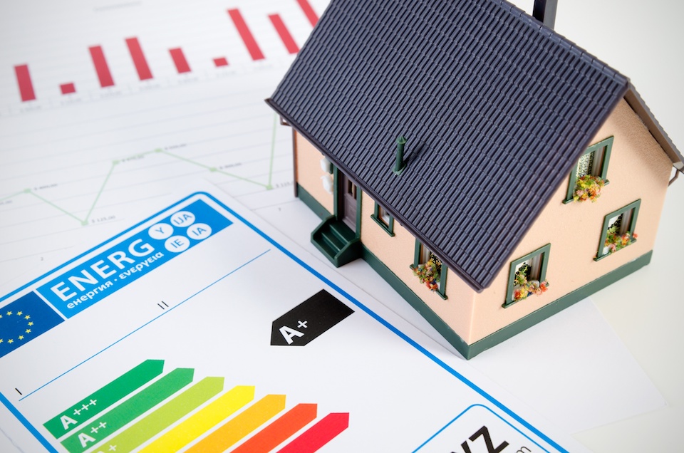 Energy efficiency concept with house model on desk